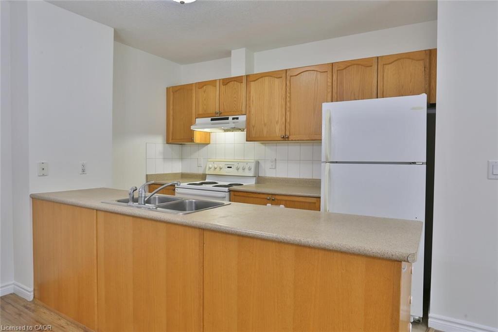 206-345 Briarmeadow Drive, Kitchener, ON - Indoor Photo Showing Kitchen With Double Sink