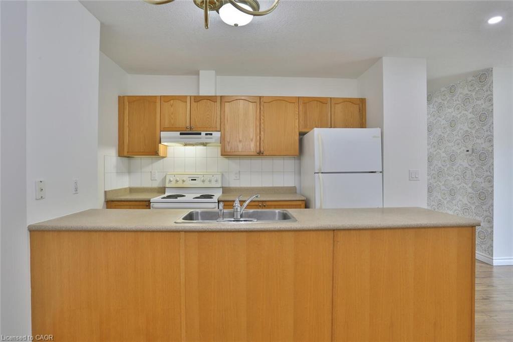 206-345 Briarmeadow Drive, Kitchener, ON - Indoor Photo Showing Kitchen With Double Sink