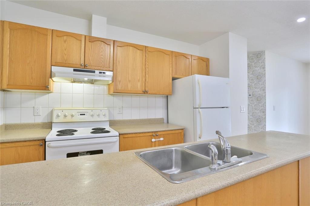 206-345 Briarmeadow Drive, Kitchener, ON - Indoor Photo Showing Kitchen With Double Sink