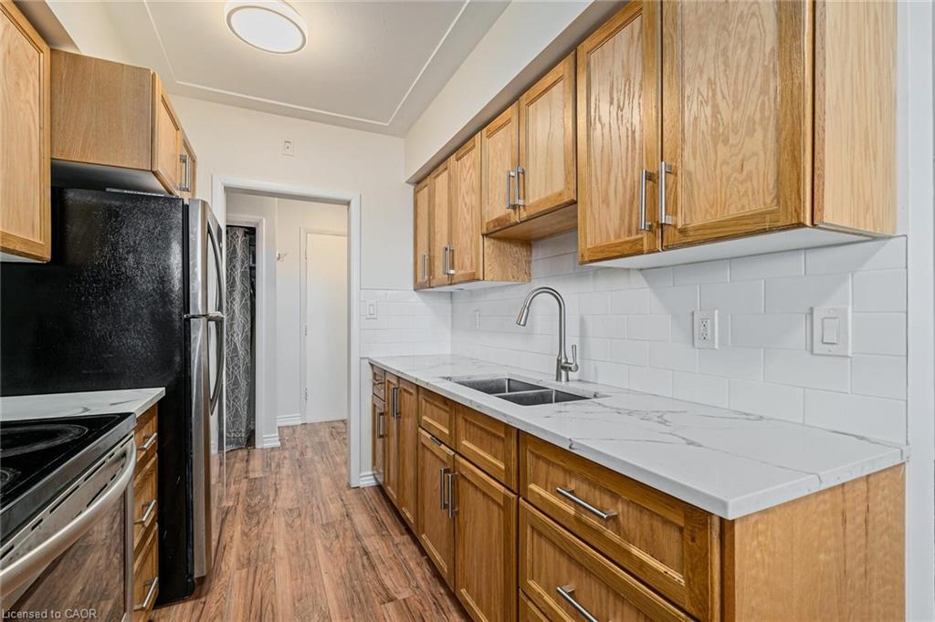 203-11 Woodman Drive, Hamilton, ON - Indoor Photo Showing Kitchen With Double Sink