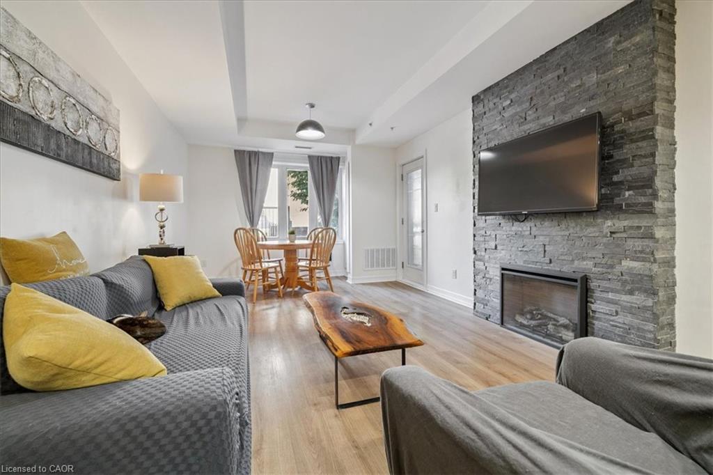 102-70 Stewart Street, Oakville, ON - Indoor Photo Showing Living Room With Fireplace
