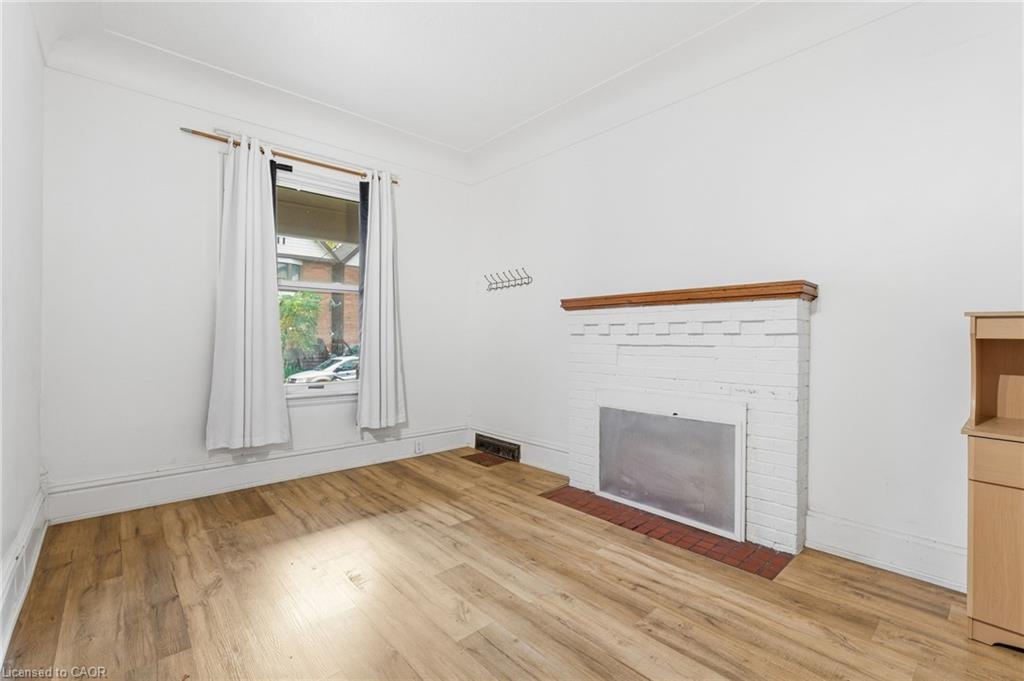 1-73 Stirton Street, Hamilton, ON - Indoor Photo Showing Other Room With Fireplace