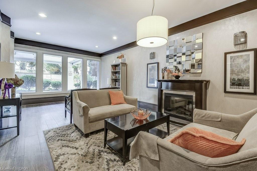 9D-67 Caroline Street S, Hamilton, ON - Indoor Photo Showing Living Room With Fireplace