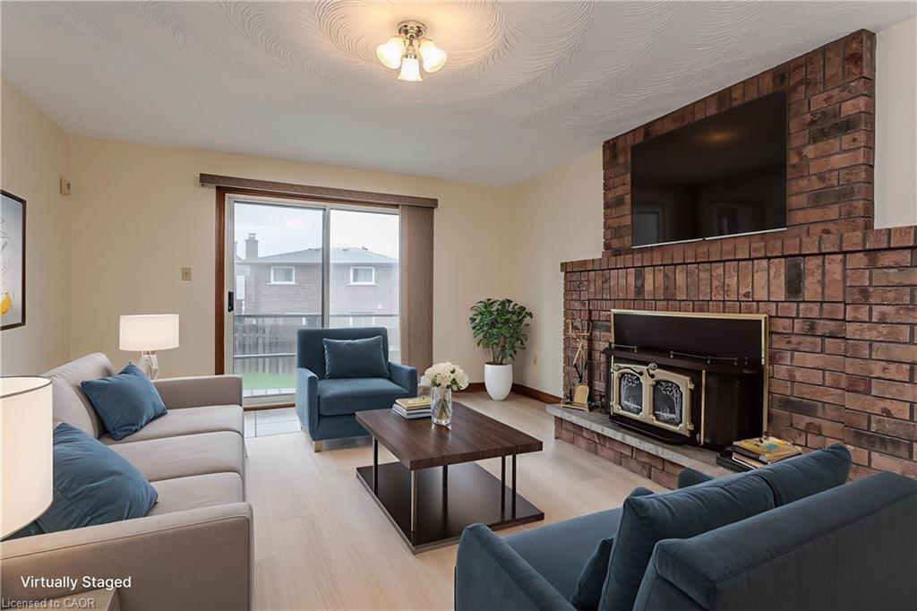18 Marcel Place, Hamilton, ON - Indoor Photo Showing Living Room With Fireplace