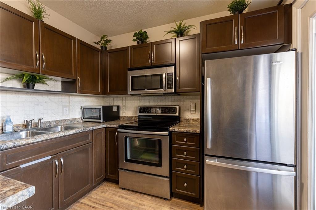 6B-38 Howe Drive, Kitchener, ON - Indoor Photo Showing Kitchen With Double Sink