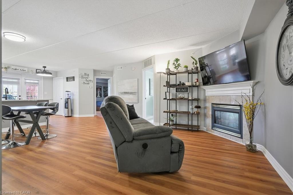 301-1431 Walkers Line, Burlington, ON - Indoor Photo Showing Living Room With Fireplace