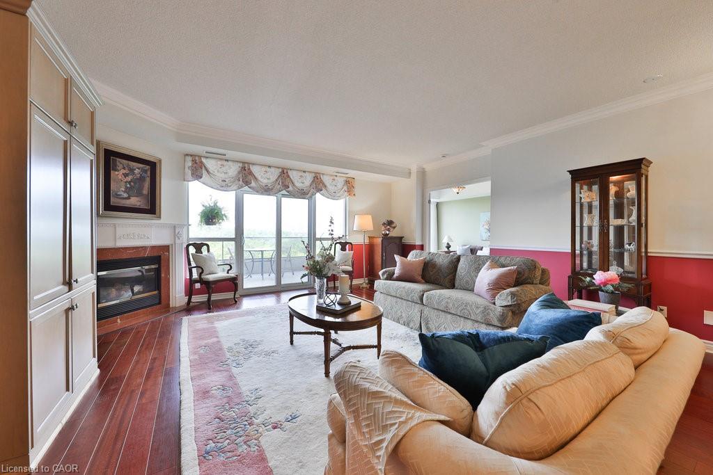 807-1900 The Collegeway, Mississauga, ON - Indoor Photo Showing Living Room With Fireplace