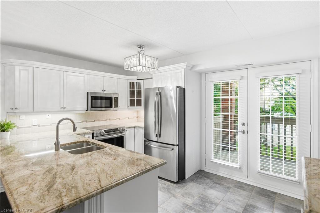 201-4013 Kilmer Drive, Burlington, ON - Indoor Photo Showing Kitchen With Stainless Steel Kitchen With Double Sink With Upgraded Kitchen