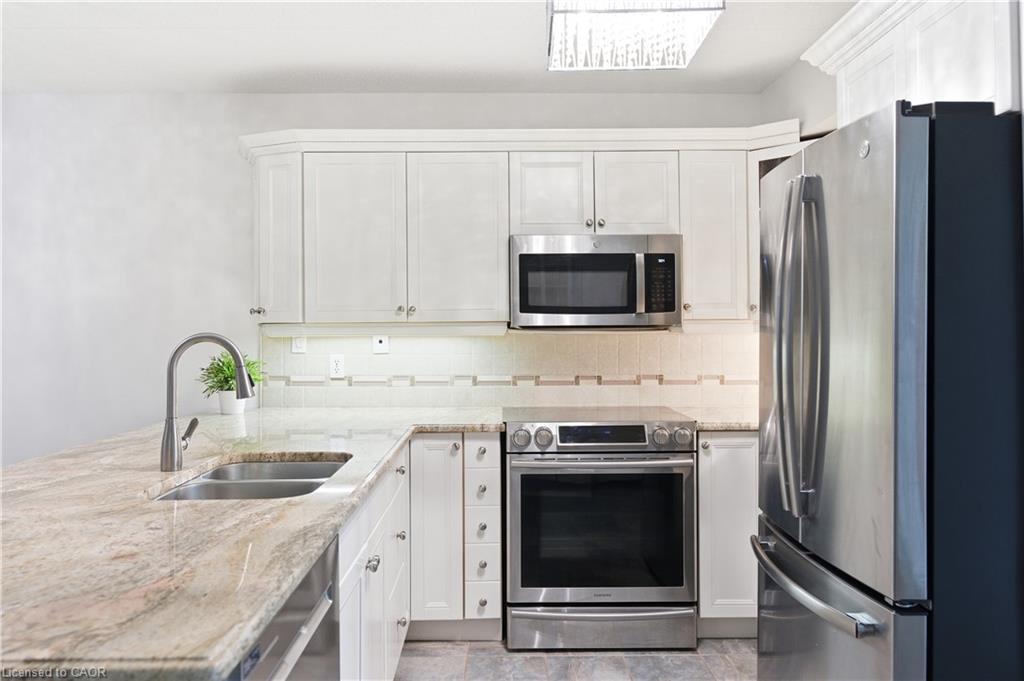 201-4013 Kilmer Drive, Burlington, ON - Indoor Photo Showing Kitchen With Stainless Steel Kitchen With Double Sink