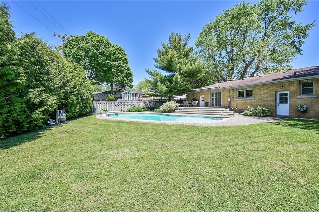128 Oneida Boulevard, Ancaster, ON - Outdoor With In Ground Pool With Backyard