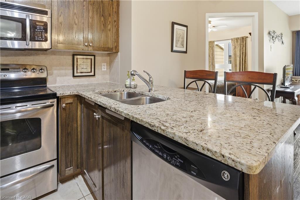 1402-330 Prince Charles Drive S, Welland, ON - Indoor Photo Showing Kitchen With Double Sink