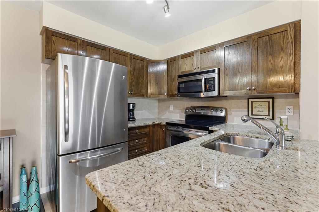 1402-330 Prince Charles Drive S, Welland, ON - Indoor Photo Showing Kitchen With Double Sink