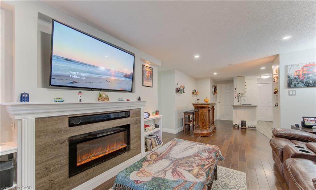 104-30 Bridge Street W, Kitchener, ON - Indoor Photo Showing Living Room With Fireplace