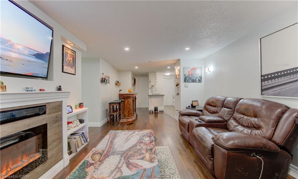 104-30 Bridge Street W, Kitchener, ON - Indoor Photo Showing Living Room With Fireplace
