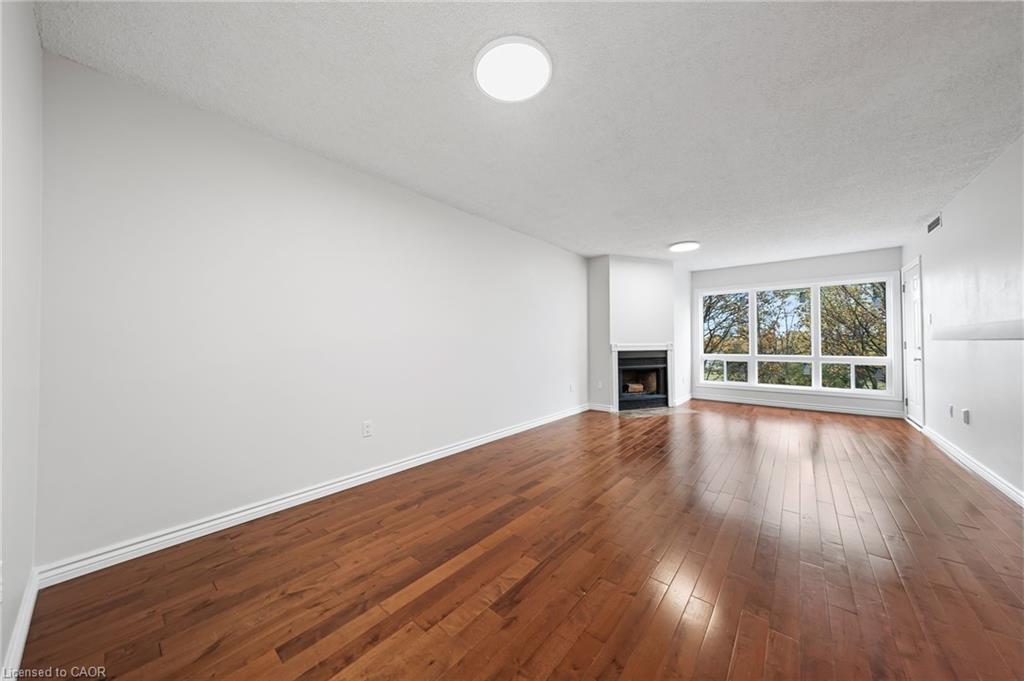 406-15 Hofstetter Avenue, Kitchener, ON - Indoor Photo Showing Living Room With Fireplace