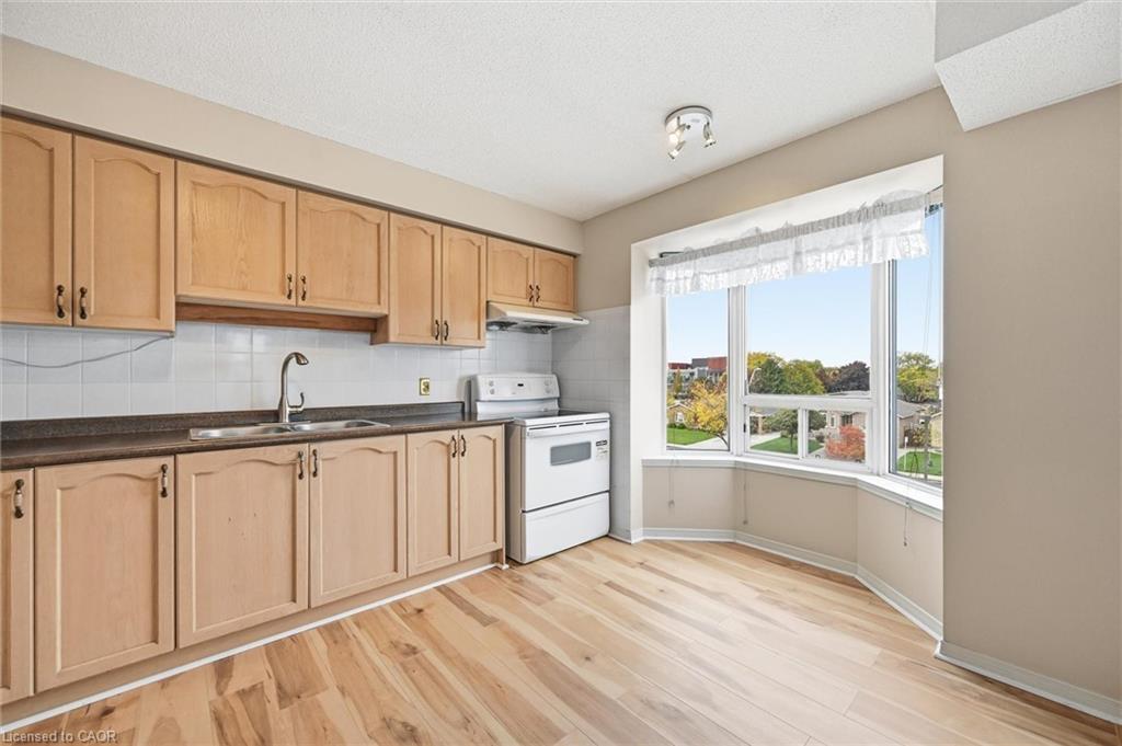 303-870 Upper Wentworth Street, Hamilton, ON - Indoor Photo Showing Kitchen With Double Sink