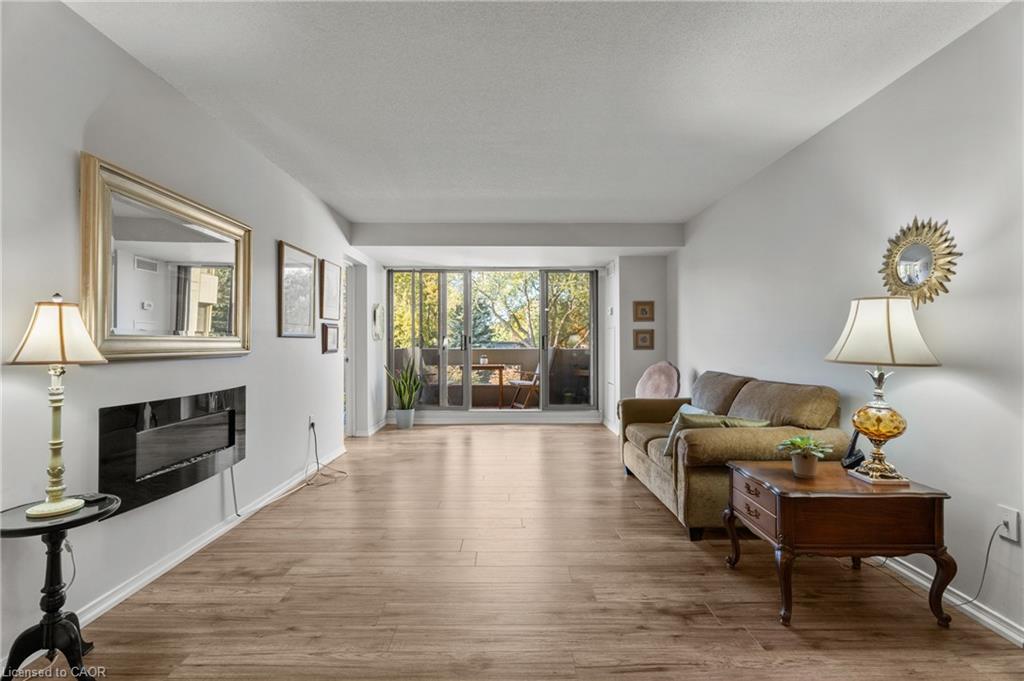 302-1201 North Shore Boulevard E, Burlington, ON - Indoor Photo Showing Living Room With Fireplace