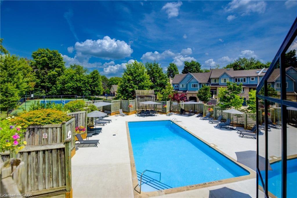 56-225 Benjamin Road, Waterloo, ON - Outdoor With In Ground Pool