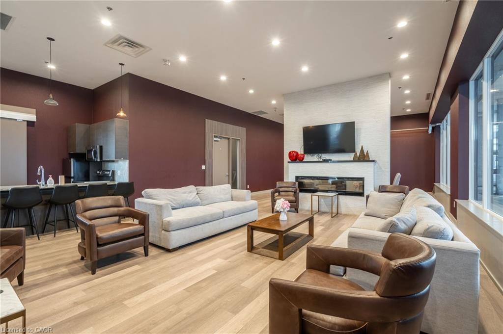 404-550 North Service Road, Grimsby, ON - Indoor Photo Showing Living Room With Fireplace