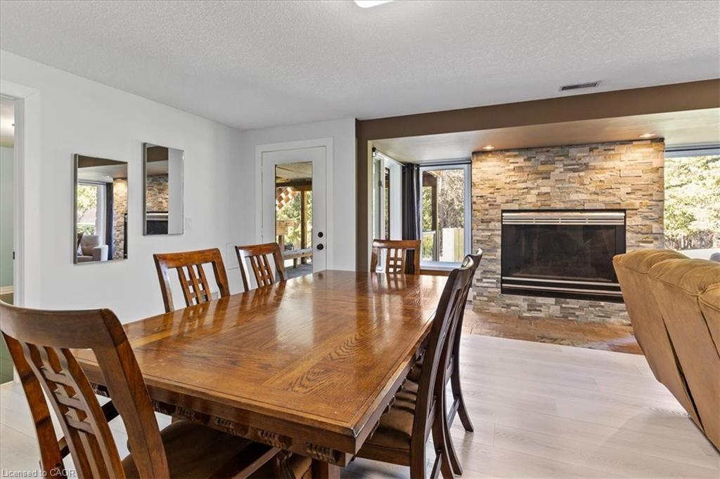 20 Grandy Lane, Cambridge, ON - Indoor Photo Showing Dining Room With Fireplace