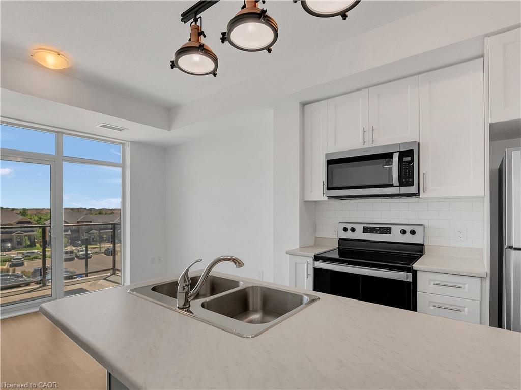319-450 Dundas Street, Waterdown, ON - Indoor Photo Showing Kitchen With Stainless Steel Kitchen With Double Sink