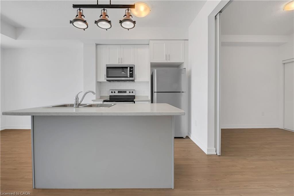 319-450 Dundas Street, Waterdown, ON - Indoor Photo Showing Kitchen With Stainless Steel Kitchen With Double Sink