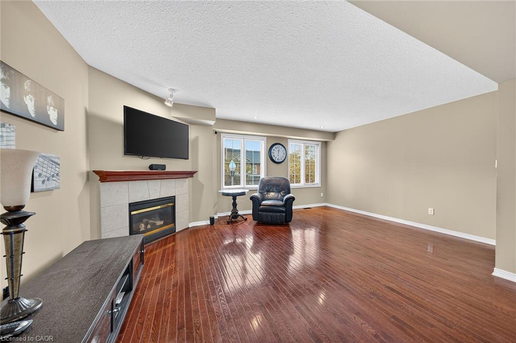 23-7 Southside Place, Hamilton, ON - Indoor Photo Showing Other Room With Fireplace