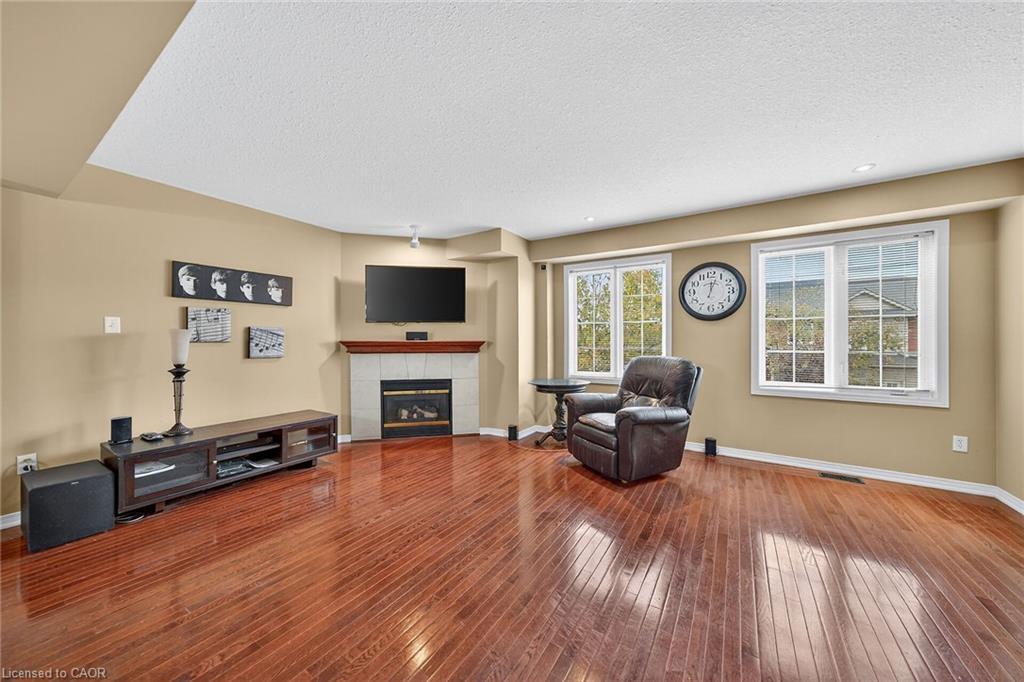 23-7 Southside Place, Hamilton, ON - Indoor Photo Showing Other Room With Fireplace