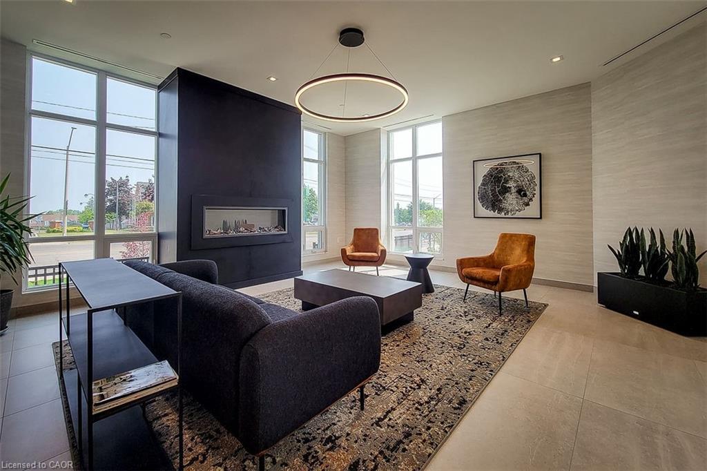 515-2750 King Street E, Hamilton, ON - Indoor Photo Showing Living Room With Fireplace