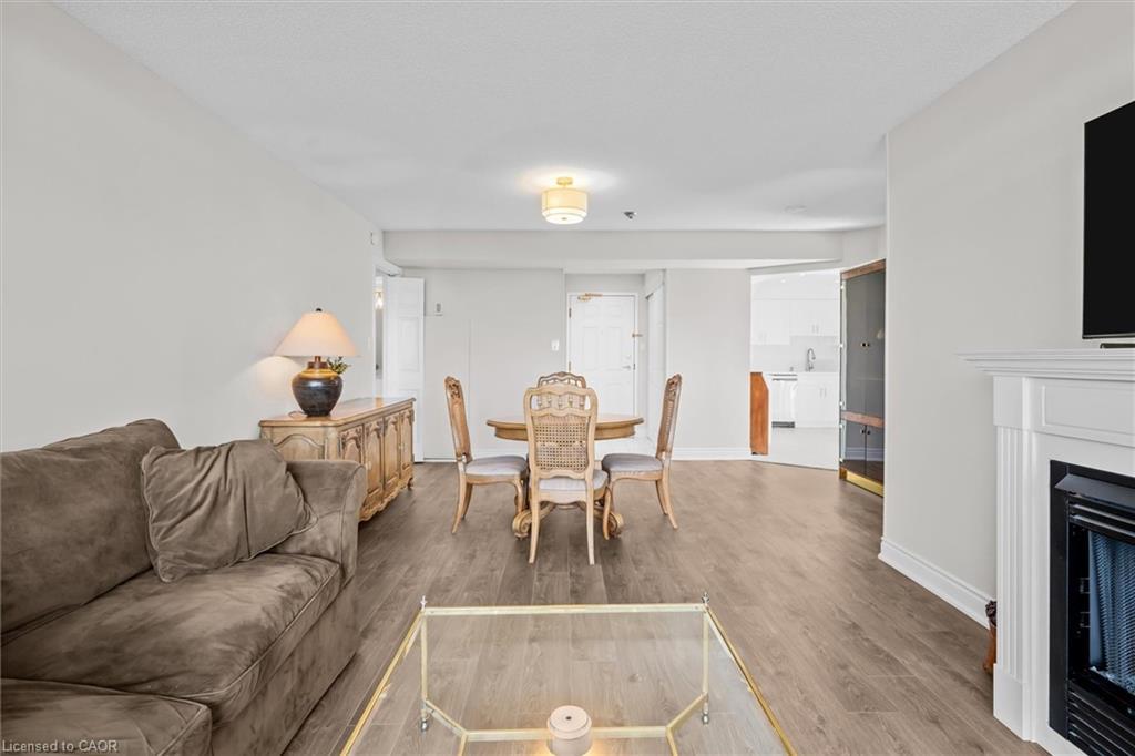 1107-5090 Pinedale Avenue, Burlington, ON - Indoor Photo Showing Living Room With Fireplace