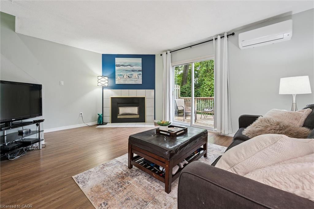 41-219 Kingswood Drive, Kitchener, ON - Indoor Photo Showing Living Room With Fireplace