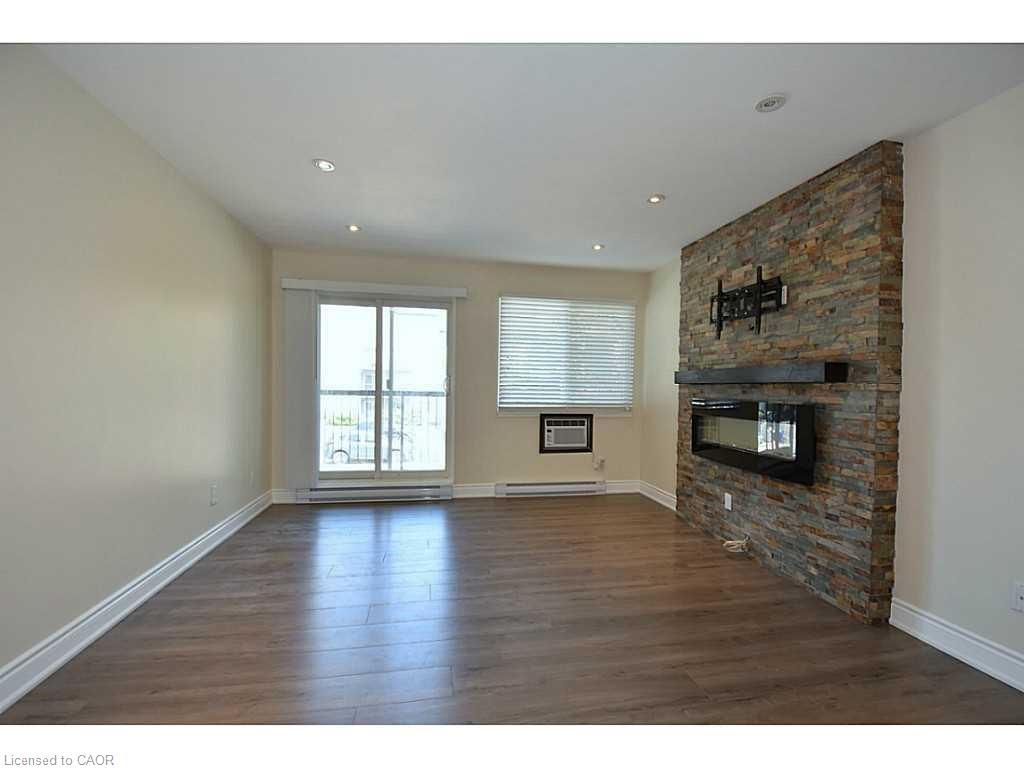821-1450 Glen Abbey Gate, Oakville, ON - Indoor With Fireplace