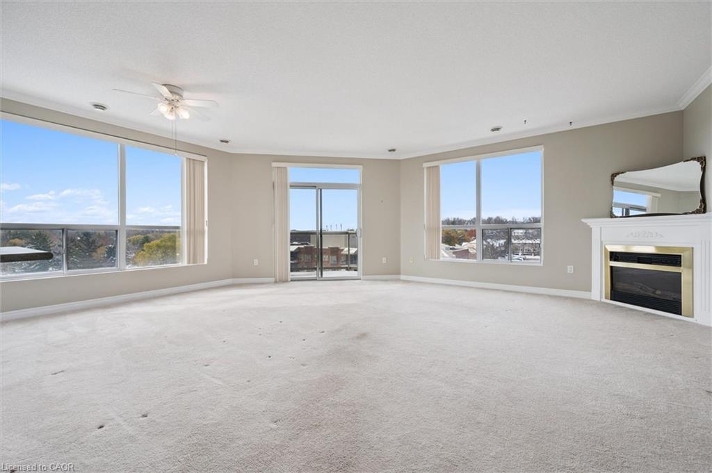 706-255 Keats Way, Waterloo, ON - Indoor Photo Showing Living Room With Fireplace