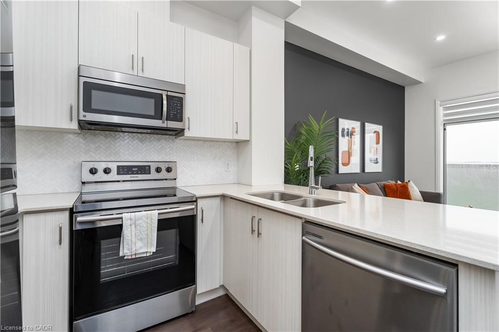 627-1105 Leger Way, Milton, ON - Indoor Photo Showing Kitchen With Double Sink