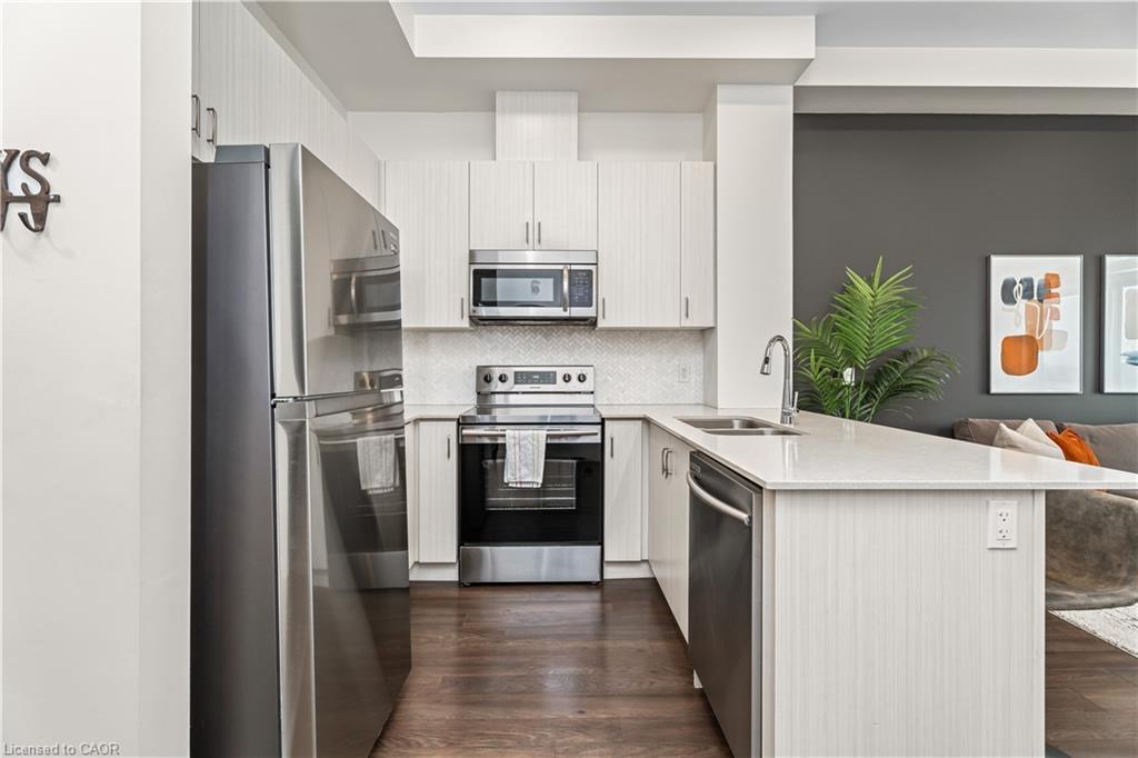 627-1105 Leger Way, Milton, ON - Indoor Photo Showing Kitchen With Double Sink