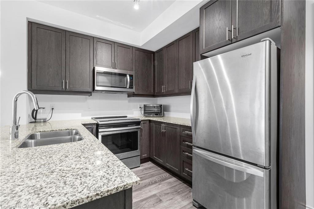 226-1050 Main Street E, Milton, ON - Indoor Photo Showing Kitchen With Double Sink