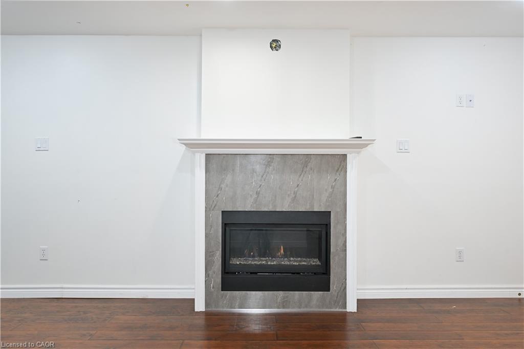 B-78 Pantano Drive, Hamilton, ON - Indoor Photo Showing Living Room With Fireplace