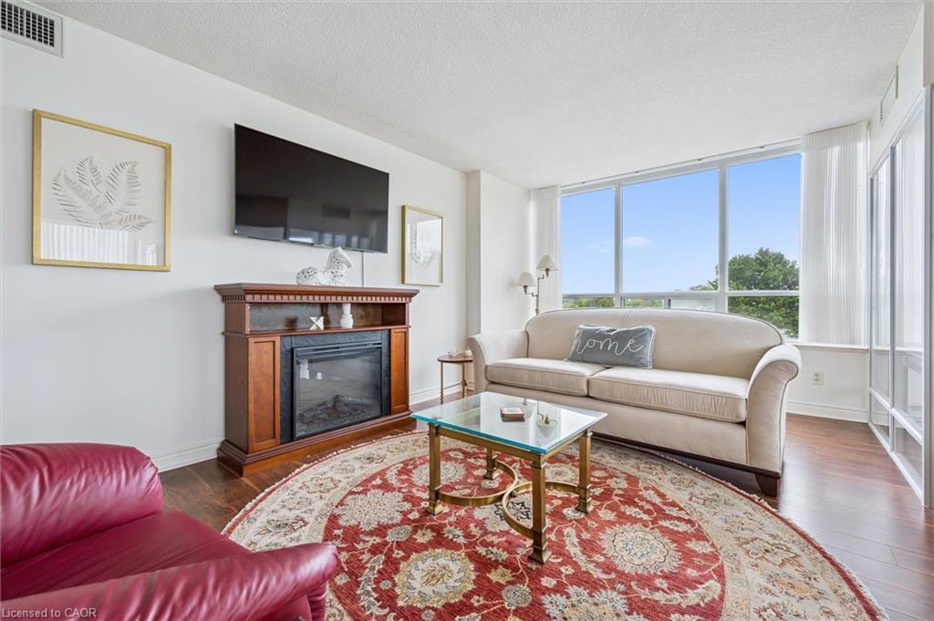 702-6 Willow Street, Waterloo, ON - Indoor Photo Showing Living Room With Fireplace