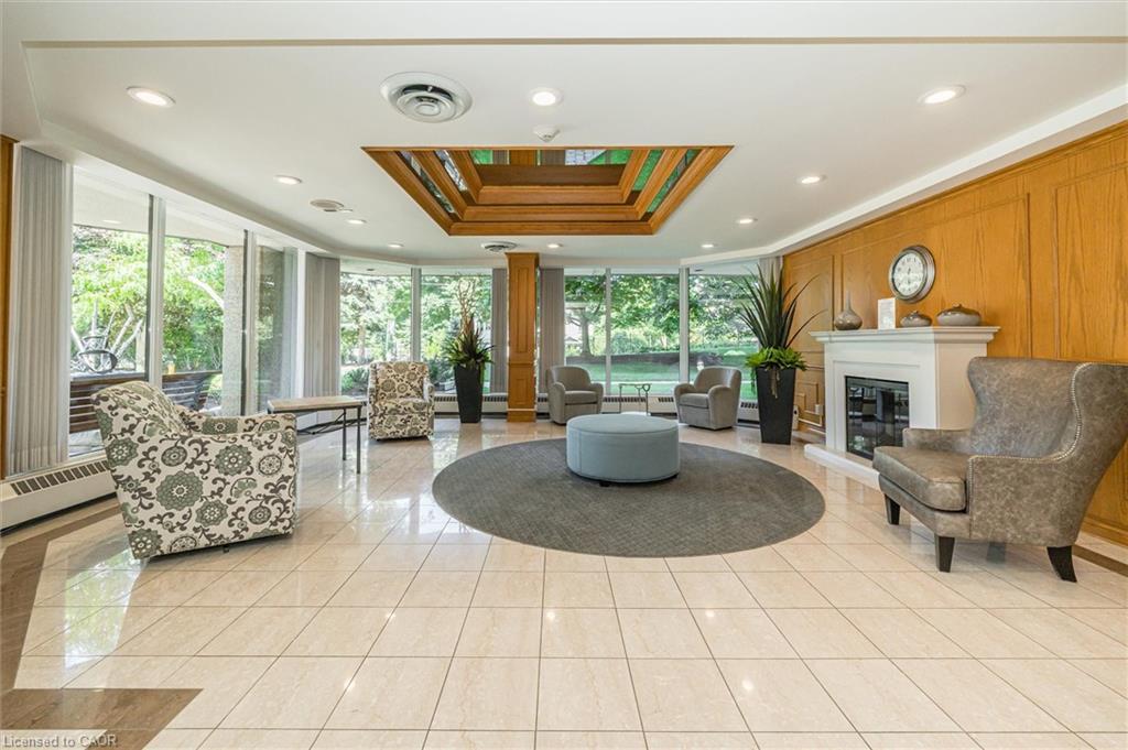 702-6 Willow Street, Waterloo, ON - Indoor Photo Showing Other Room With Fireplace