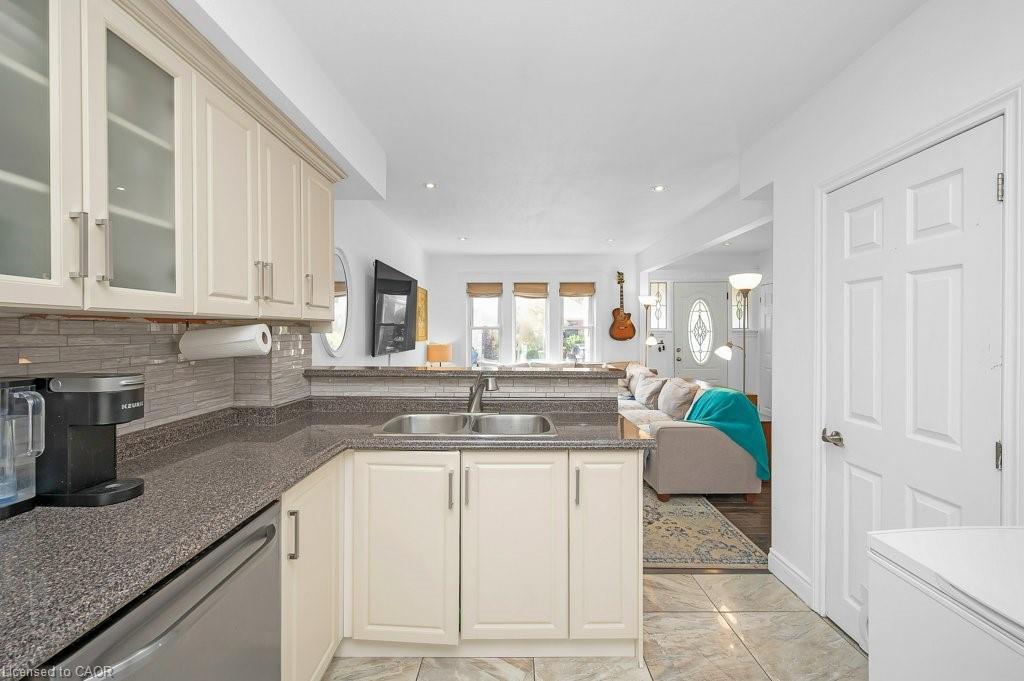128 Crosthwaite Avenue N, Hamilton, ON - Indoor Photo Showing Kitchen With Double Sink