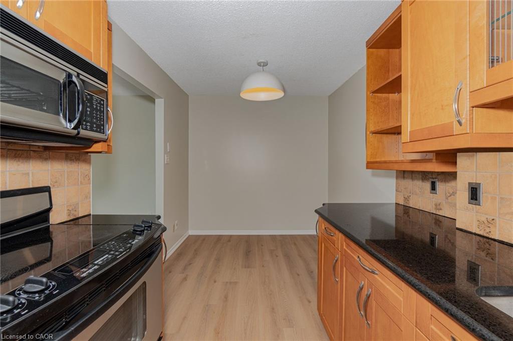 505-75 Queen Street N, Hamilton, ON - Indoor Photo Showing Kitchen With Fireplace