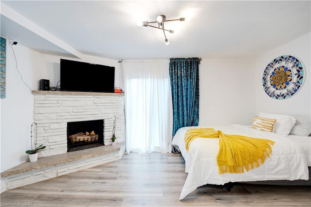 7250 Maywood Street, Niagara Falls, ON - Indoor Photo Showing Bedroom With Fireplace