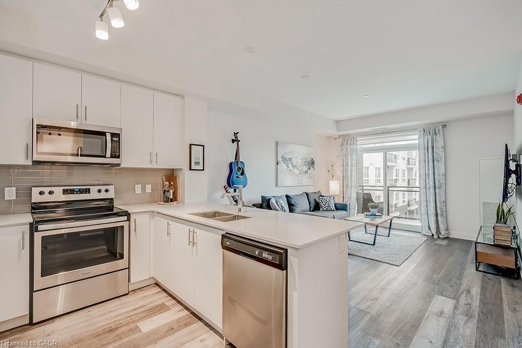 502-320 Plains Road E, Burlington, ON - Indoor Photo Showing Kitchen With Stainless Steel Kitchen With Double Sink