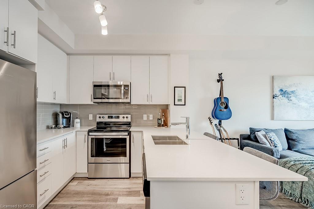 502-320 Plains Road E, Burlington, ON - Indoor Photo Showing Kitchen With Stainless Steel Kitchen With Double Sink