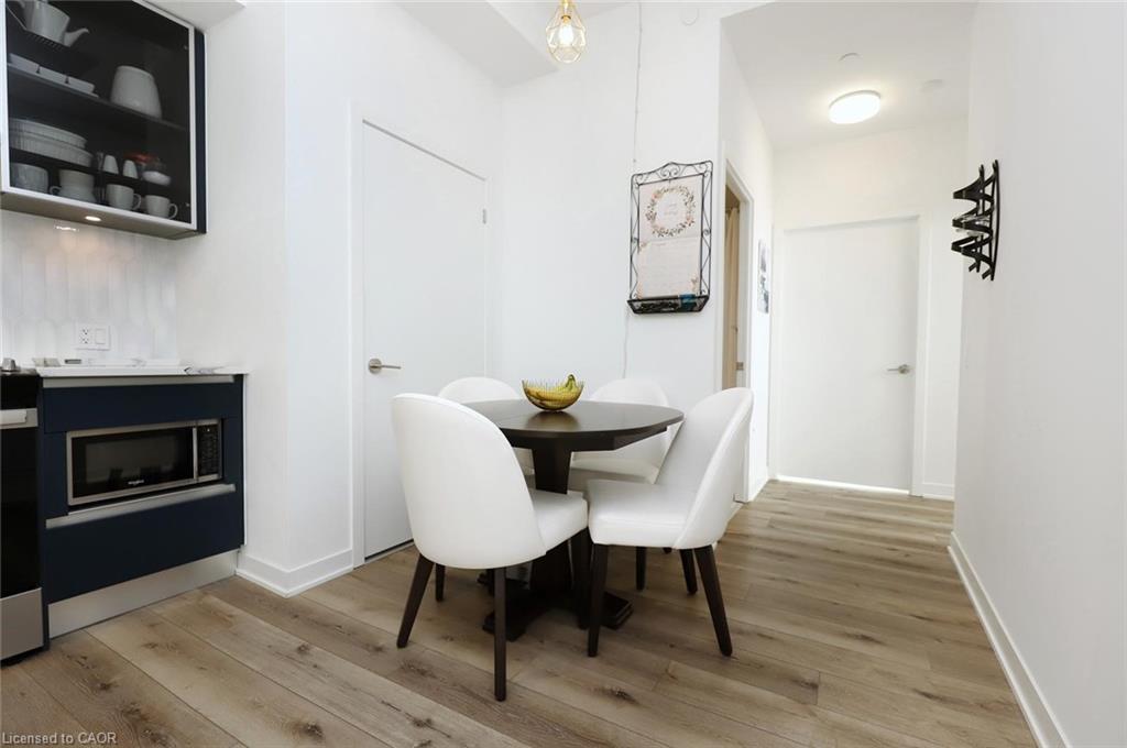 Ph02-405 Dundas Street W, Oakville, ON - Indoor Photo Showing Dining Room With Fireplace