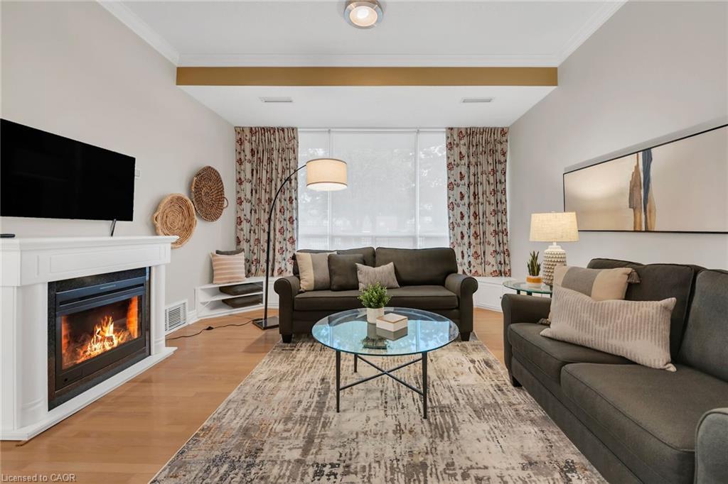 105-1770 Main Street W, Hamilton, ON - Indoor Photo Showing Living Room With Fireplace