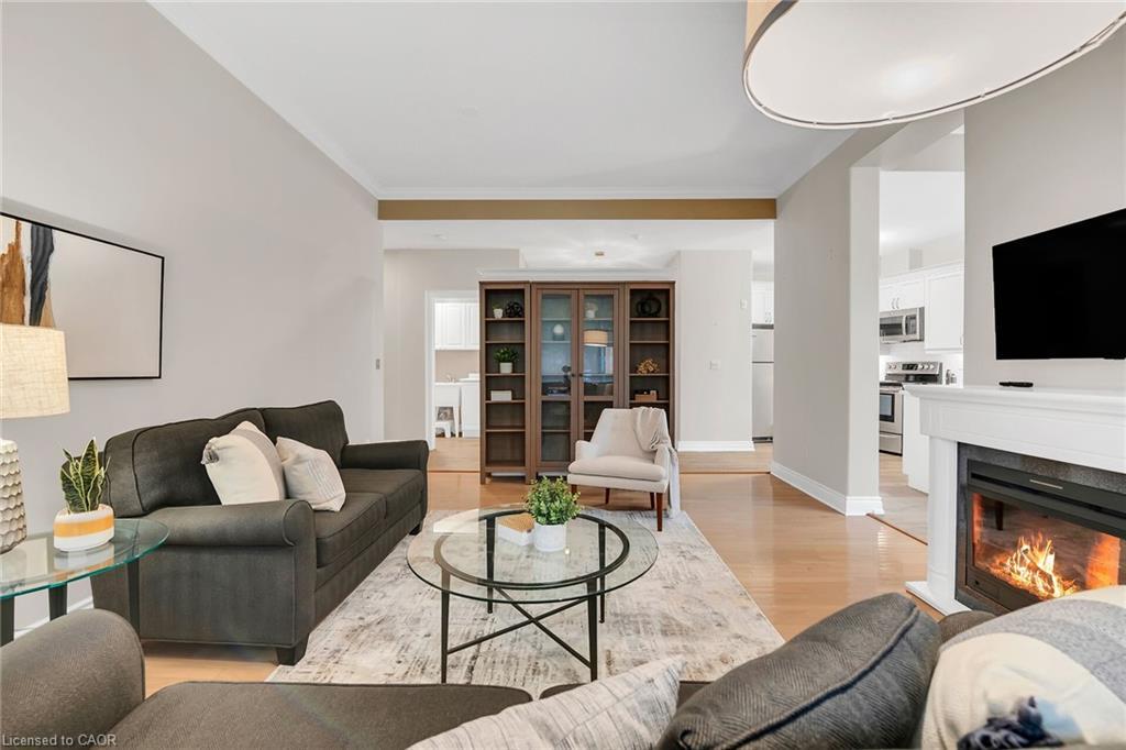 105-1770 Main Street W, Hamilton, ON - Indoor Photo Showing Living Room With Fireplace