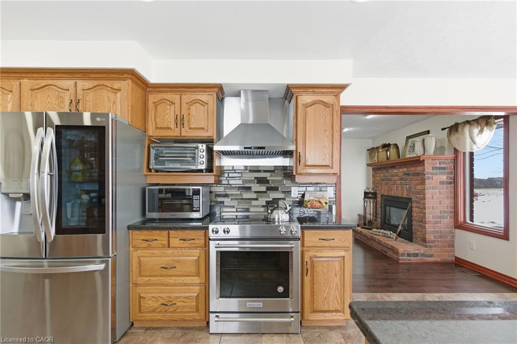 3810 River Road, Caledonia, ON - Indoor Photo Showing Kitchen With Fireplace