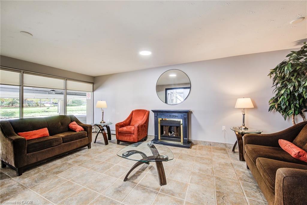202-58 Bridgeport Road E, Waterloo, ON - Indoor Photo Showing Living Room With Fireplace