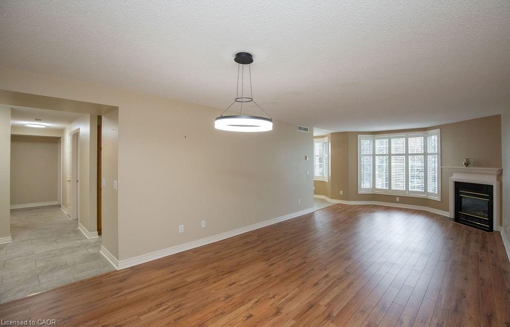 202-990 Golf Links Road, Hamilton, ON - Indoor Photo Showing Living Room With Fireplace